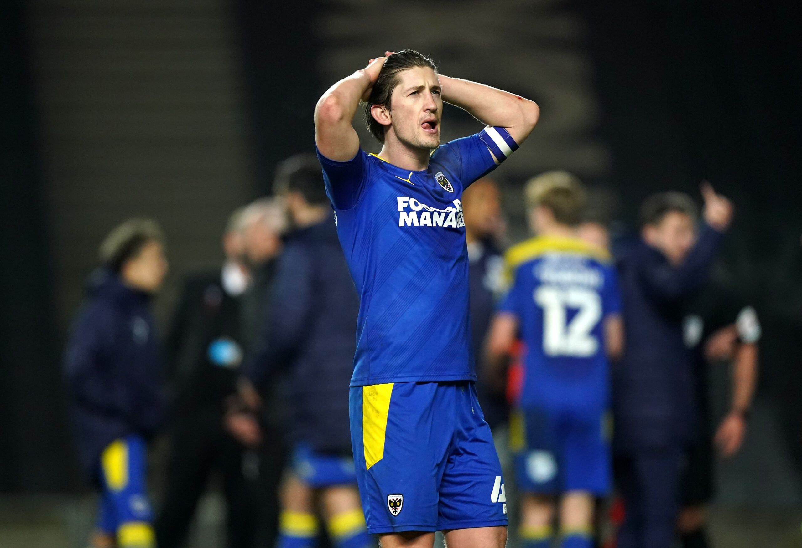 AFC Wimbledon survive on League Two day of destiny